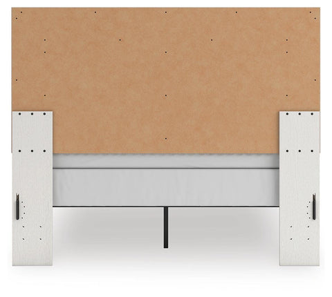 Zuraleus Upholstered Panel Bed, Dresser, Mirror and Chest
