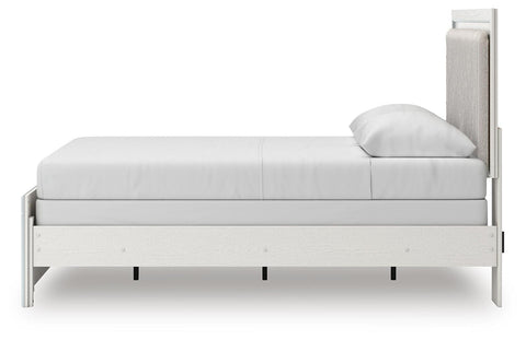 Zuraleus Upholstered Panel Bed, Dresser, Mirror and Chest