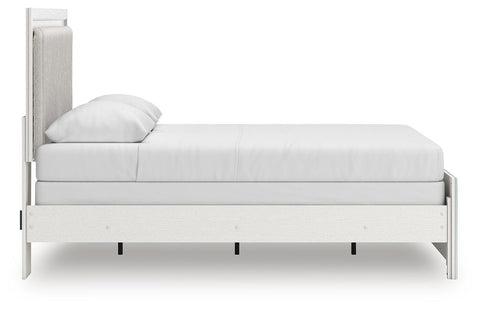 Zuraleus Upholstered Panel Bed, Dresser, Mirror and Chest