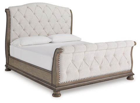 Ardenfield Upholstered Sleigh Bed and 2 Nightstands