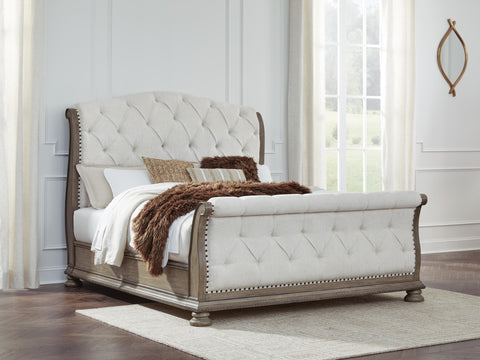 Ardenfield Upholstered Sleigh Bed and 2 Nightstands